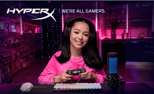 Bella Poarch is on a pink sweatshirt playing video games with HyperX.